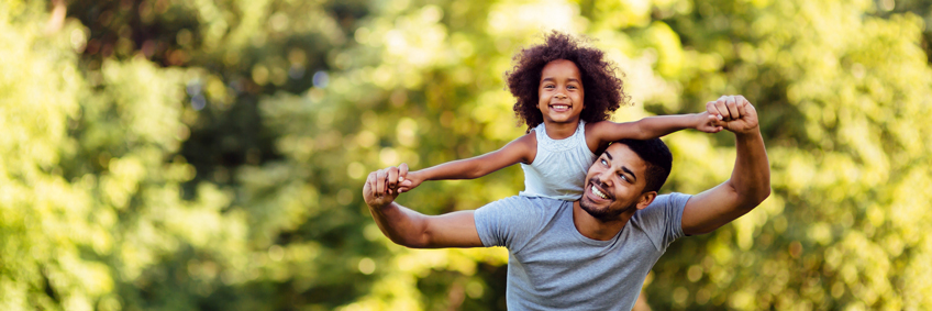 happy daughter on dad's back