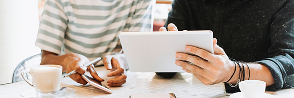 people looking at tablet publications