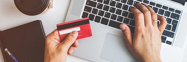person paying online with credit card