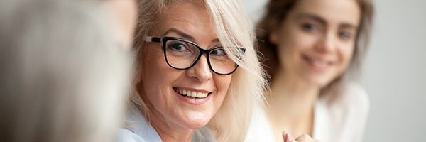 women with thick-rimmed glasses looking right