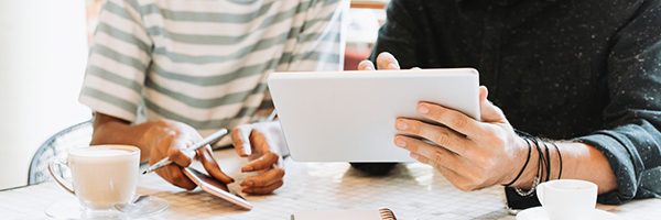 people looking at tablet publications